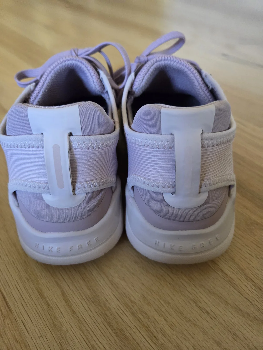 Nike Women's Pink Lilac Athletic Running Sneakers with White Swoosh